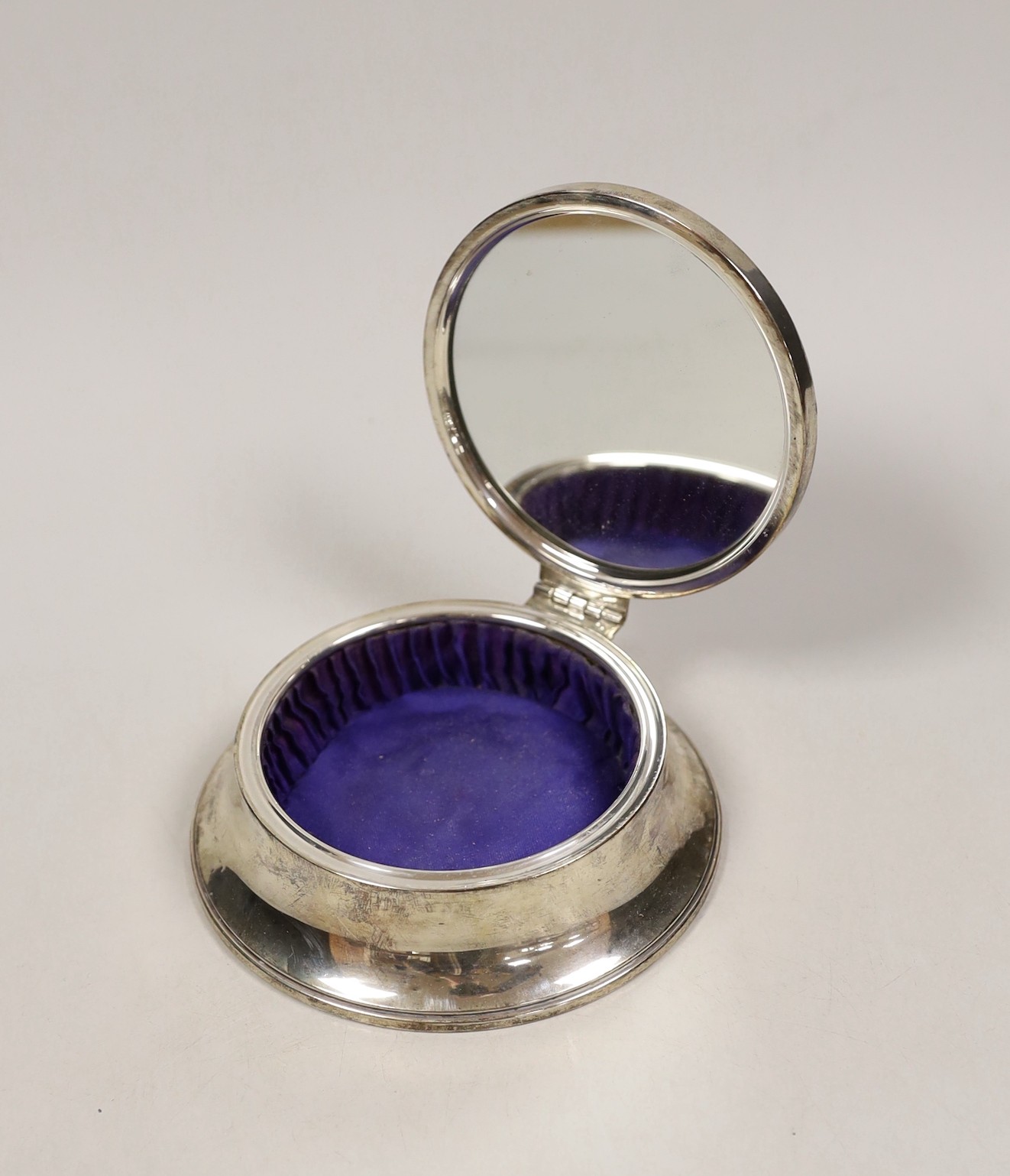 A 1950's part engine turned silver mounted circular jewellery casket, base diameter 12.8cm.